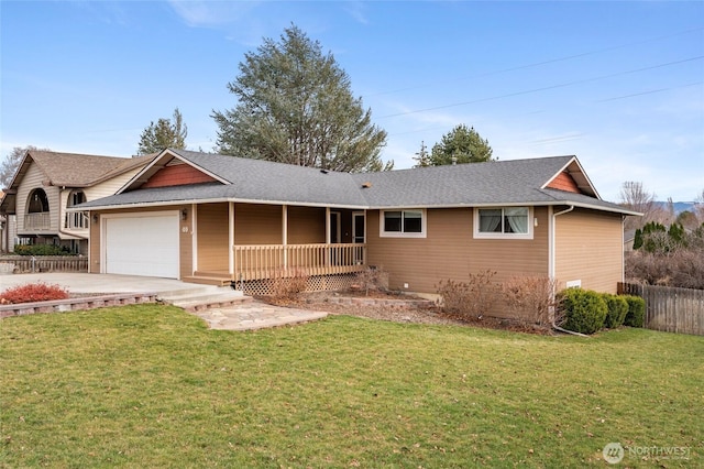 ranch-style home featuring concrete driveway, an attached garage, covered porch, fence, and a front yard