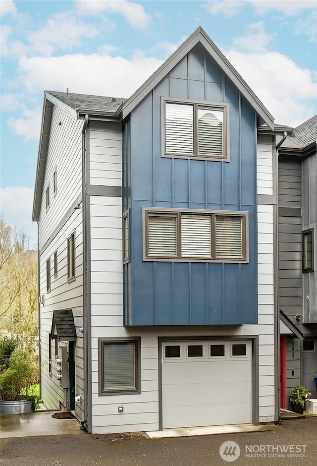 view of front facade featuring a garage and board and batten siding