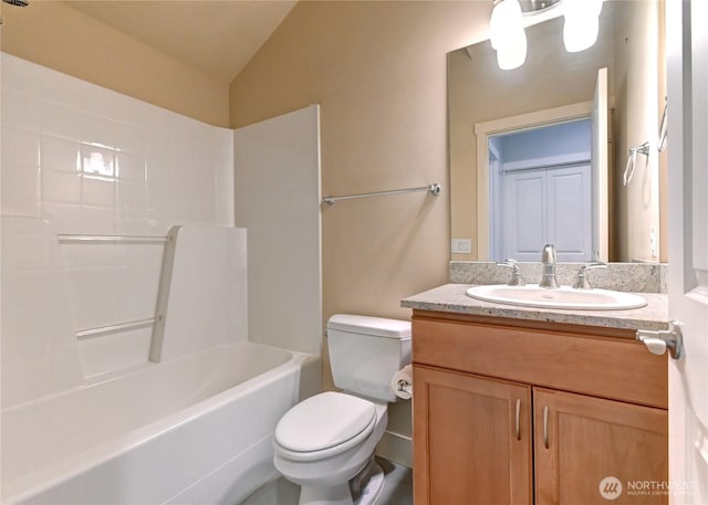 bathroom featuring toilet, vanity, bathing tub / shower combination, and vaulted ceiling