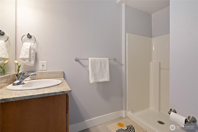 5939 Delridge Way SW, Seattle, WA 98106 - bathroom featuring a shower stall, vanity, baseboards, and tile patterned floors