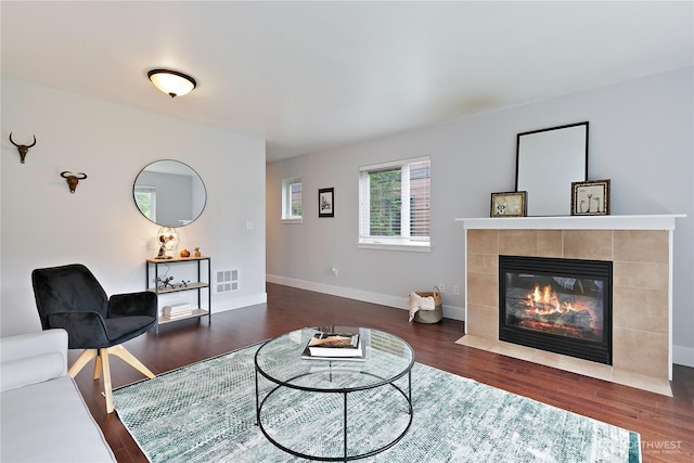 5939 Delridge Way SW, Seattle, WA 98106 - living room with dark wood-style flooring, a fireplace, and baseboards