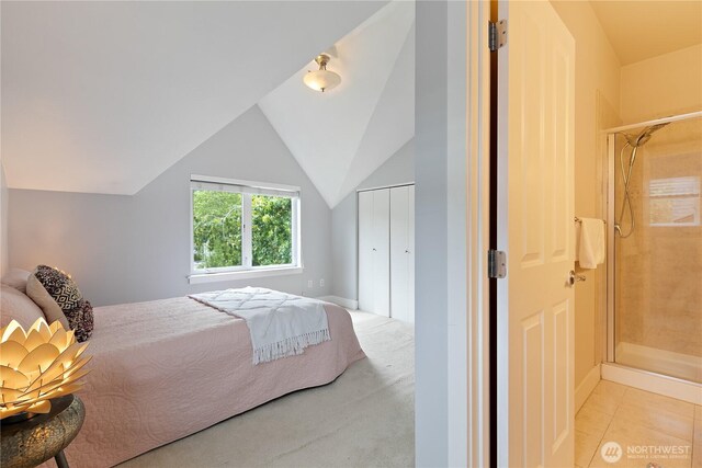 5939 Delridge Way SW, Seattle, WA 98106 - bedroom featuring lofted ceiling, a closet, and light tile patterned floors