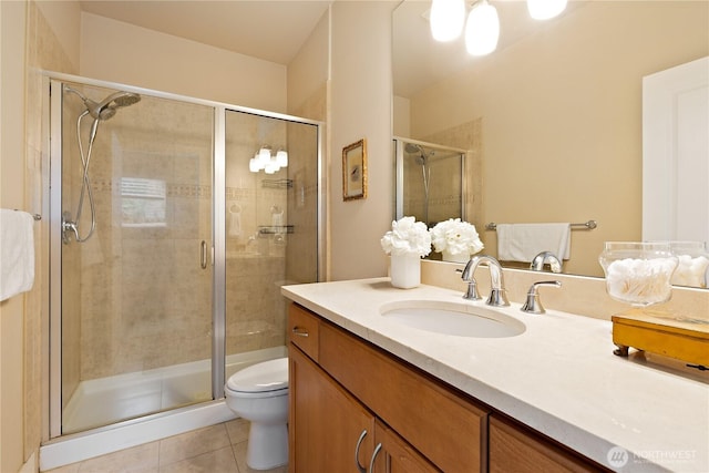 5939 Delridge Way SW, Seattle, WA 98106 - bathroom featuring tile patterned floors, a stall shower, toilet, and vanity