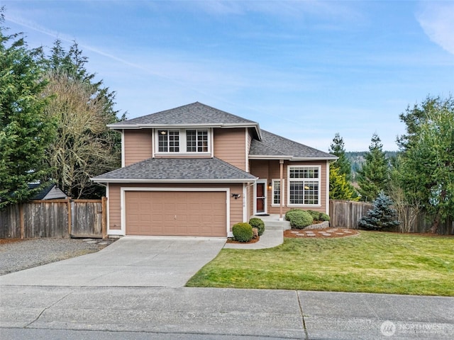 view of front facade with driveway, a shingled roof, fence, and a front yard