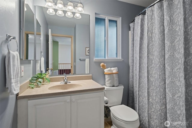 full bathroom featuring toilet and vanity