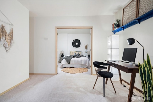 bedroom featuring carpet and baseboards