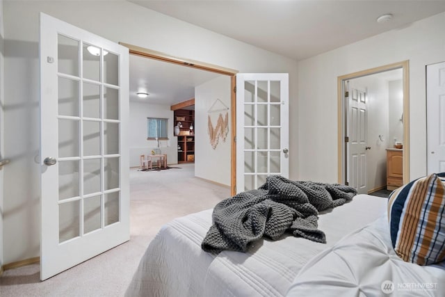 carpeted bedroom with french doors