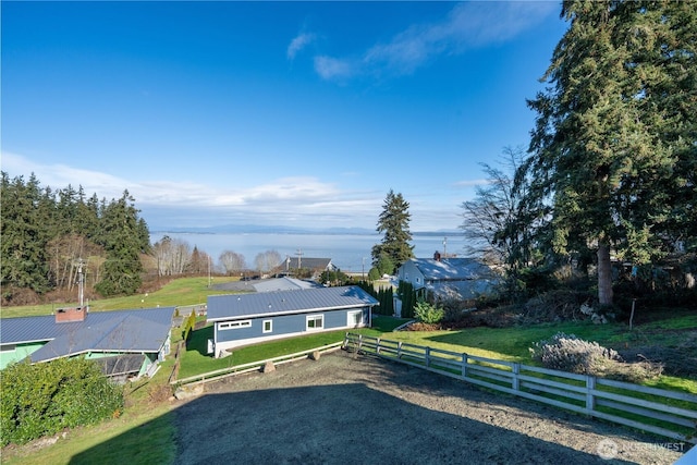 exterior space with a front yard and fence