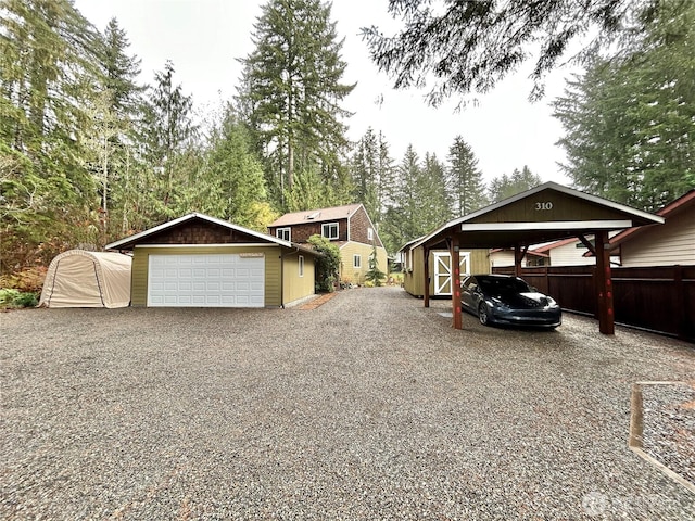 exterior space featuring an outbuilding and a garage