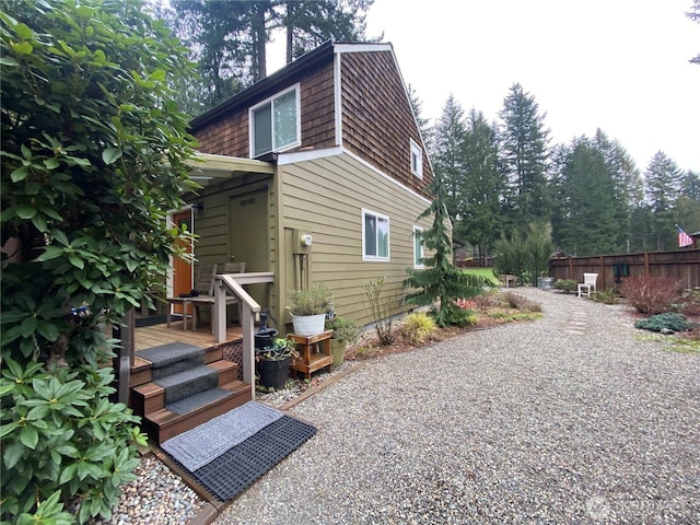 view of side of property with fence