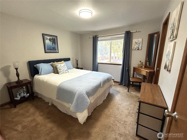 carpeted bedroom with baseboards