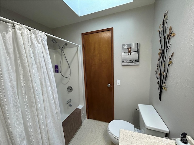 full bathroom with shower / bath combo, a skylight, toilet, and tile patterned floors