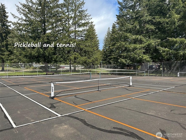 view of sport court featuring fence