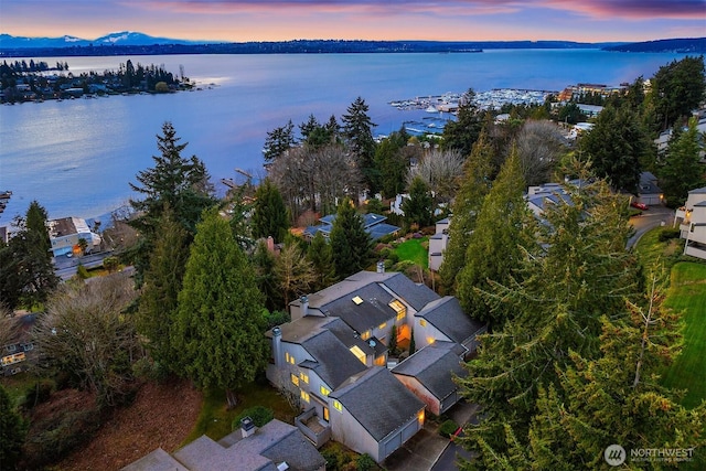 aerial view at dusk with a water view