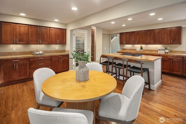 dining area featuring recessed lighting and light wood-style floors