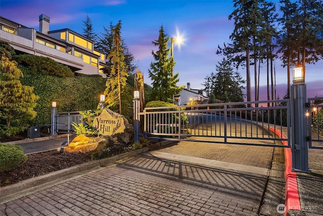 view of gate at dusk