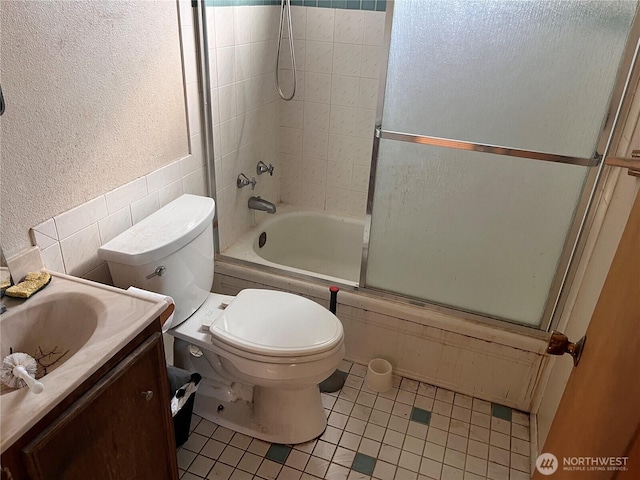 12535 SE Kent Kangley Rd, Kent, WA 98030 - bathroom with tile patterned floors, enclosed tub / shower combo, a textured wall, toilet, and vanity