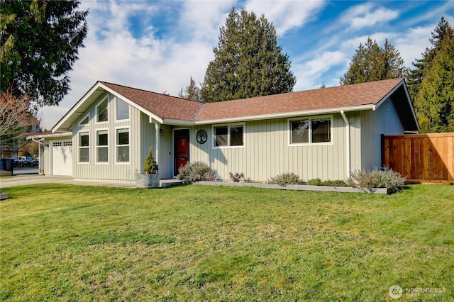 ranch-style house with a front lawn, a shingled roof, an attached garage, and fence