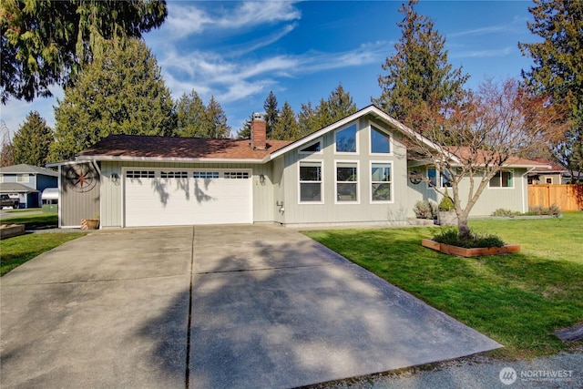 view of front of home featuring fence, a chimney, a front lawn, concrete driveway, and a garage