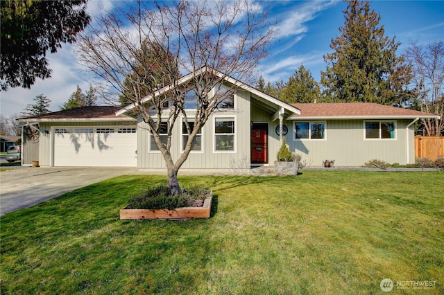 ranch-style house with concrete driveway, fence, a garage, and a front yard