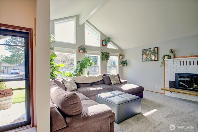 carpeted living room featuring beam ceiling, a fireplace, and high vaulted ceiling