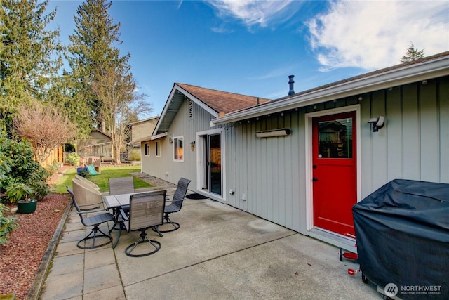 view of patio featuring outdoor dining space and fence