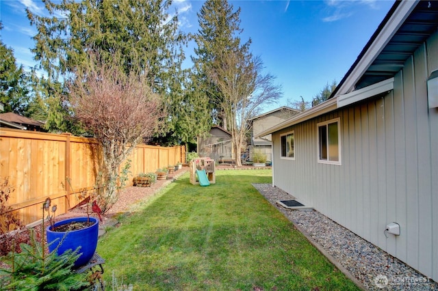 view of yard with a fenced backyard