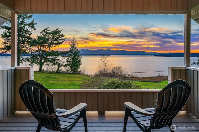 deck featuring a water and mountain view