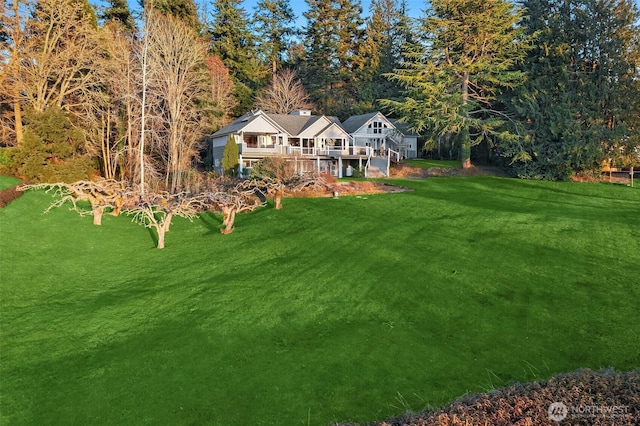 view of yard featuring a wooden deck