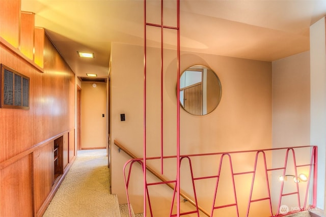 corridor with light colored carpet and visible vents