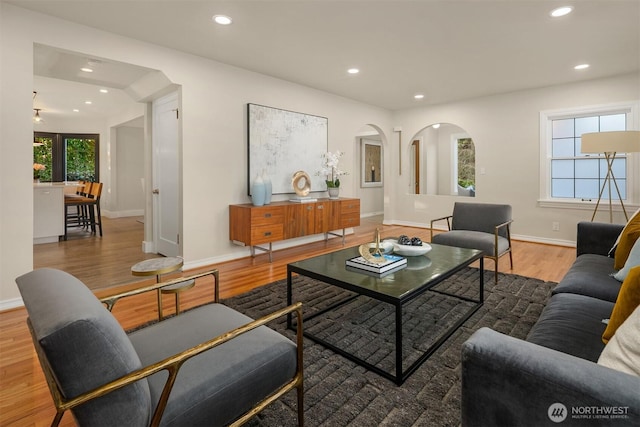 living area featuring plenty of natural light, recessed lighting, and wood finished floors