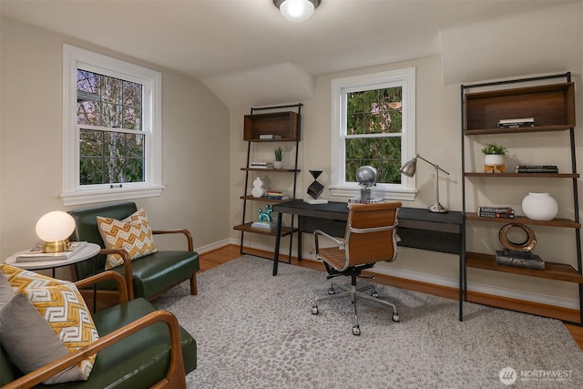 office area with baseboards, lofted ceiling, and wood finished floors