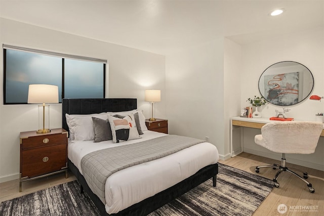 bedroom featuring recessed lighting, wood finished floors, and baseboards