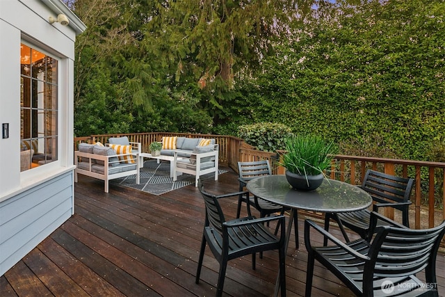 deck featuring outdoor dining space and an outdoor hangout area