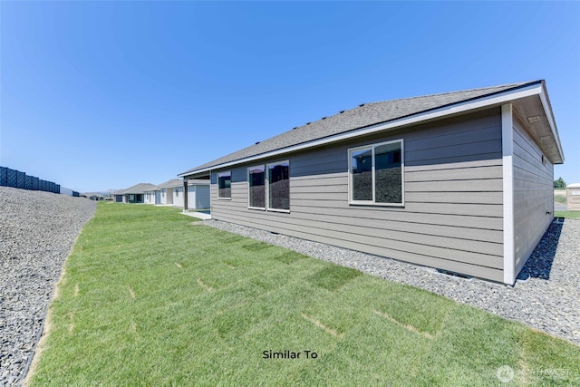 view of home's exterior featuring a yard