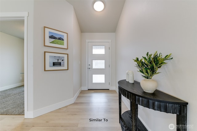 entrance foyer featuring light wood-style floors and baseboards