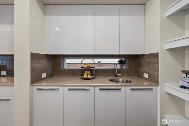 kitchen with white cabinetry and modern cabinets