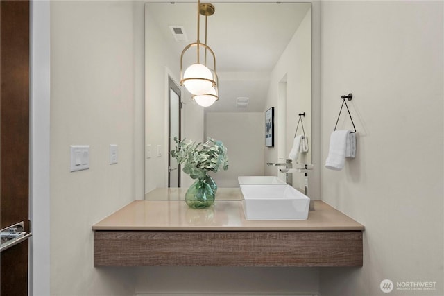 bathroom with visible vents and vanity