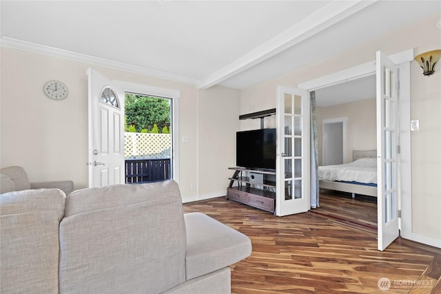 living room featuring ornamental molding, french doors, beam ceiling, and wood finished floors