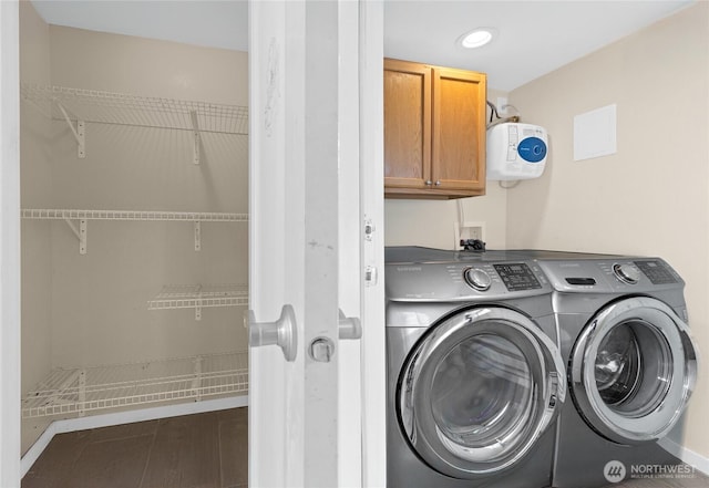 washroom with recessed lighting, cabinet space, and independent washer and dryer