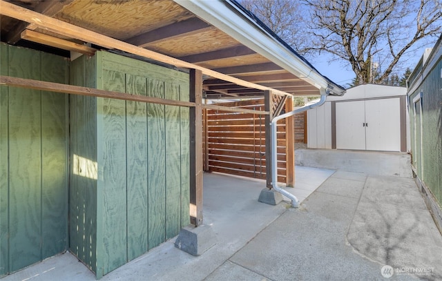 view of patio / terrace featuring a shed and an outdoor structure