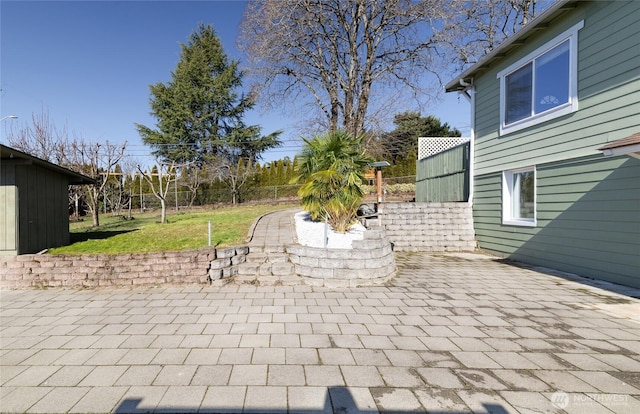 view of patio / terrace featuring fence