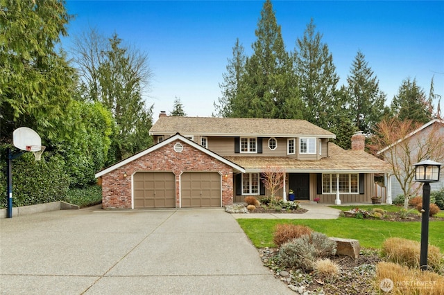 traditional-style home with brick siding, a porch, concrete driveway, a chimney, and a garage