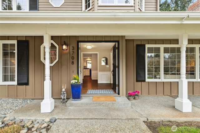 doorway to property featuring board and batten siding