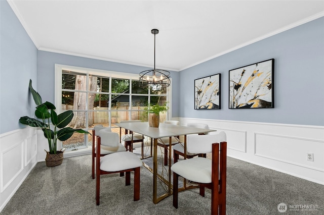 dining room featuring plenty of natural light, a chandelier, and carpet flooring