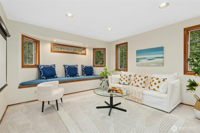 living room with recessed lighting, baseboards, and carpet flooring