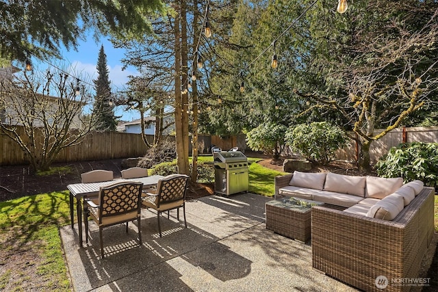 view of patio / terrace featuring outdoor dining space, a fenced backyard, and an outdoor hangout area