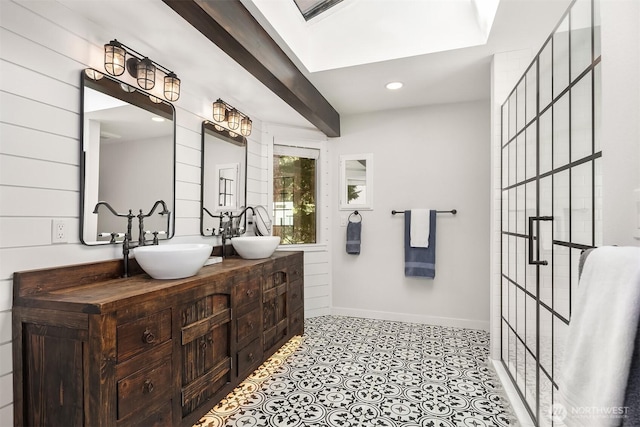 full bath with recessed lighting, a sink, baseboards, and double vanity