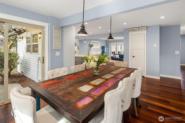 dining space featuring dark wood-style floors, recessed lighting, and baseboards