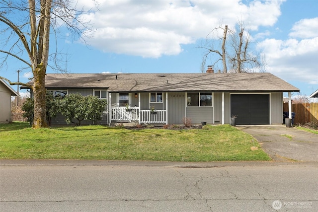 ranch-style home featuring a garage, driveway, a front lawn, and fence